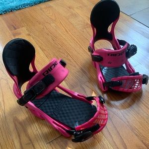 Hot pink Ride brand women’s snowboard bindings